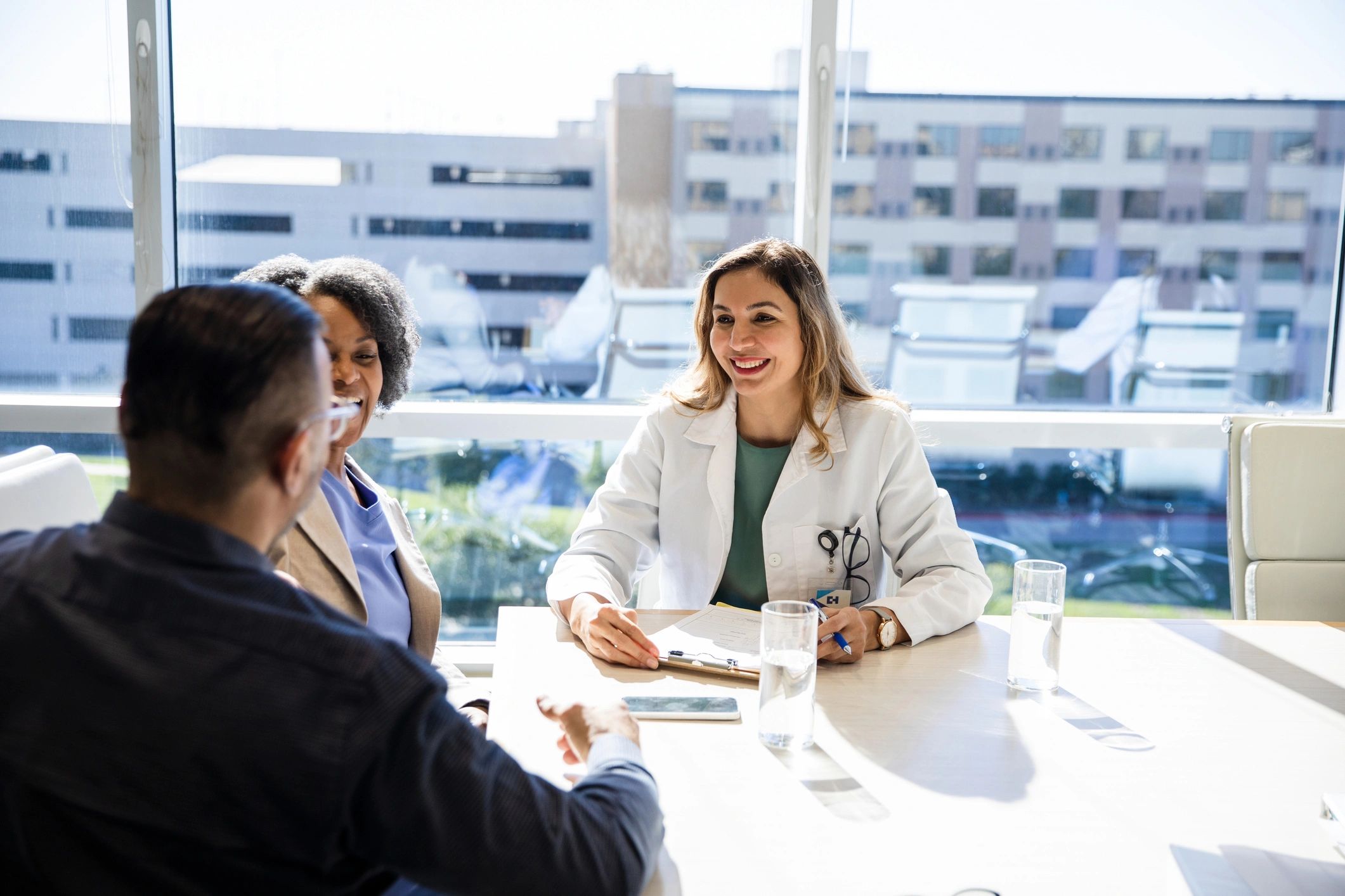 Healthcare strategist smiling during consultation