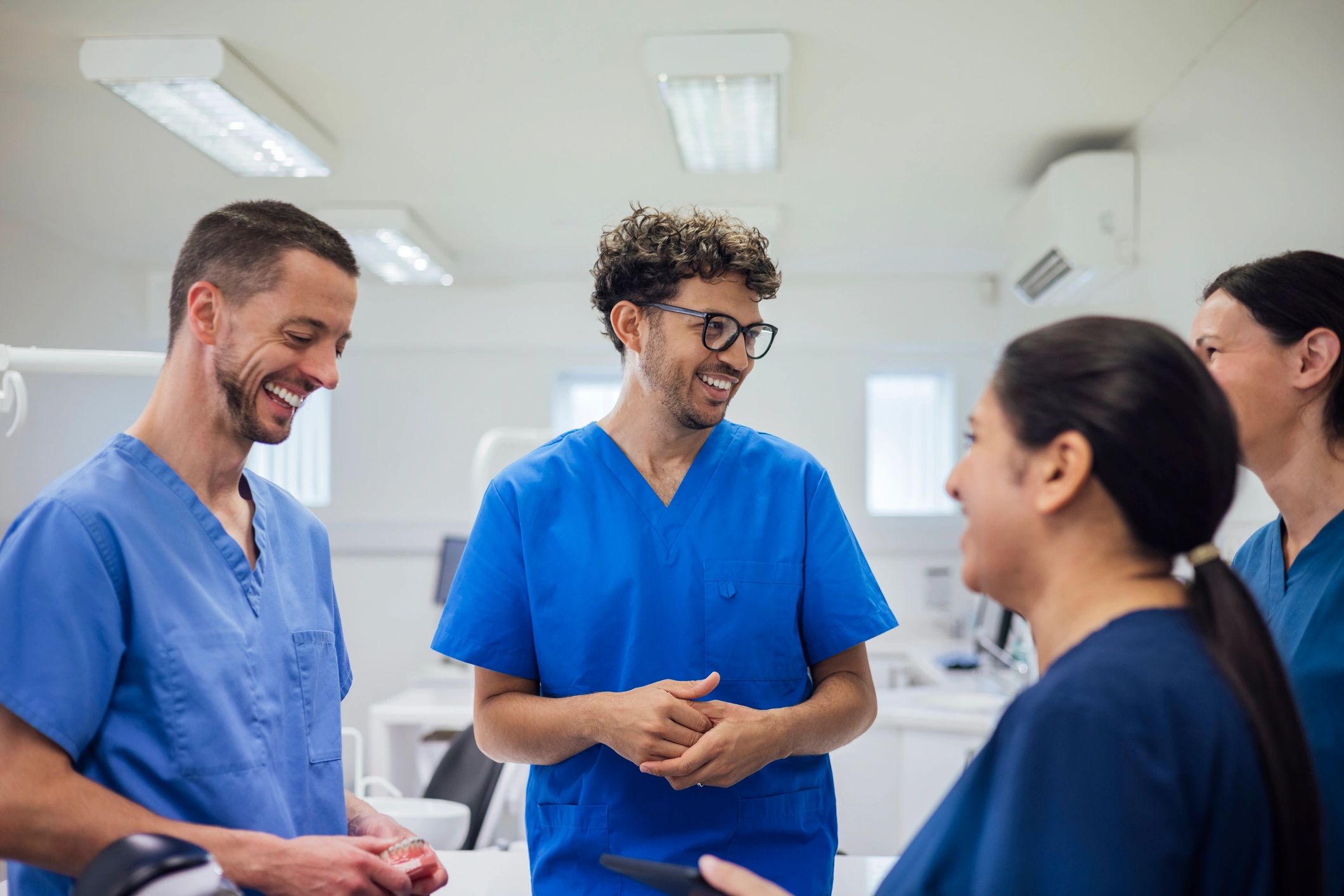 Dental professionals standing together in a practice